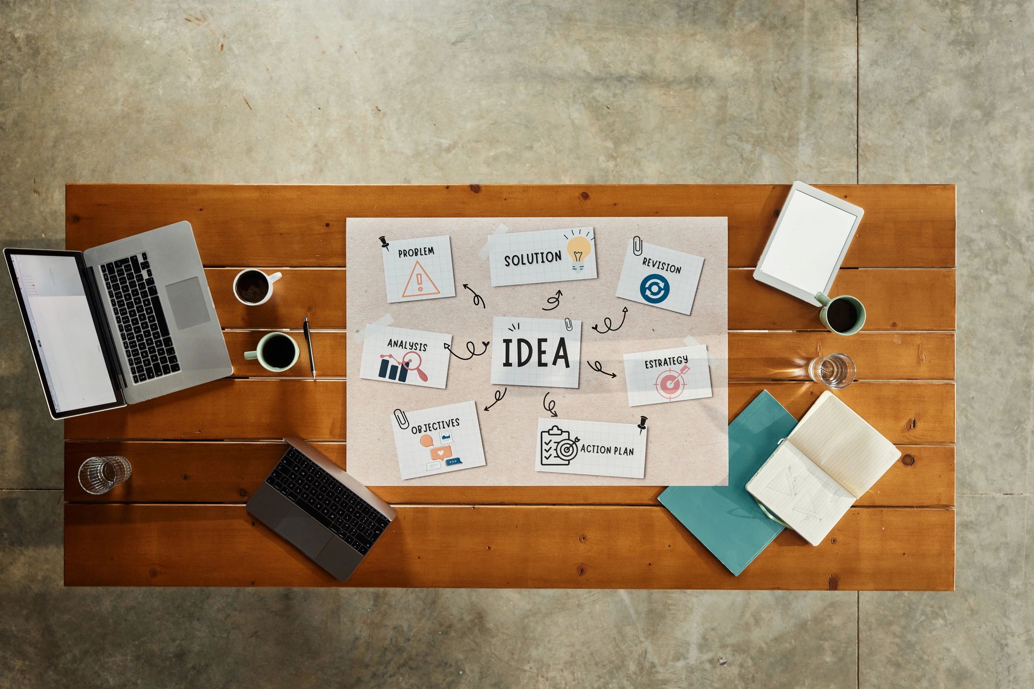 Creative desk flat lay with paper and tools, leaving space for artwork and notes